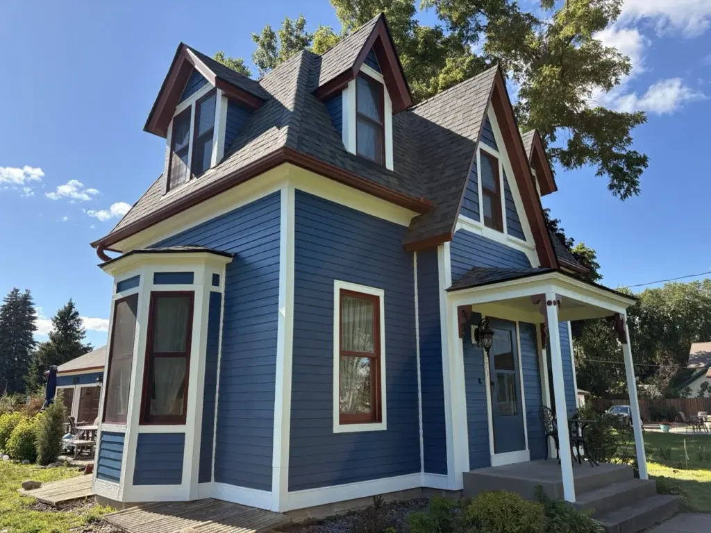 Exterior house painting by Smooth Painting — blue victorian hero
