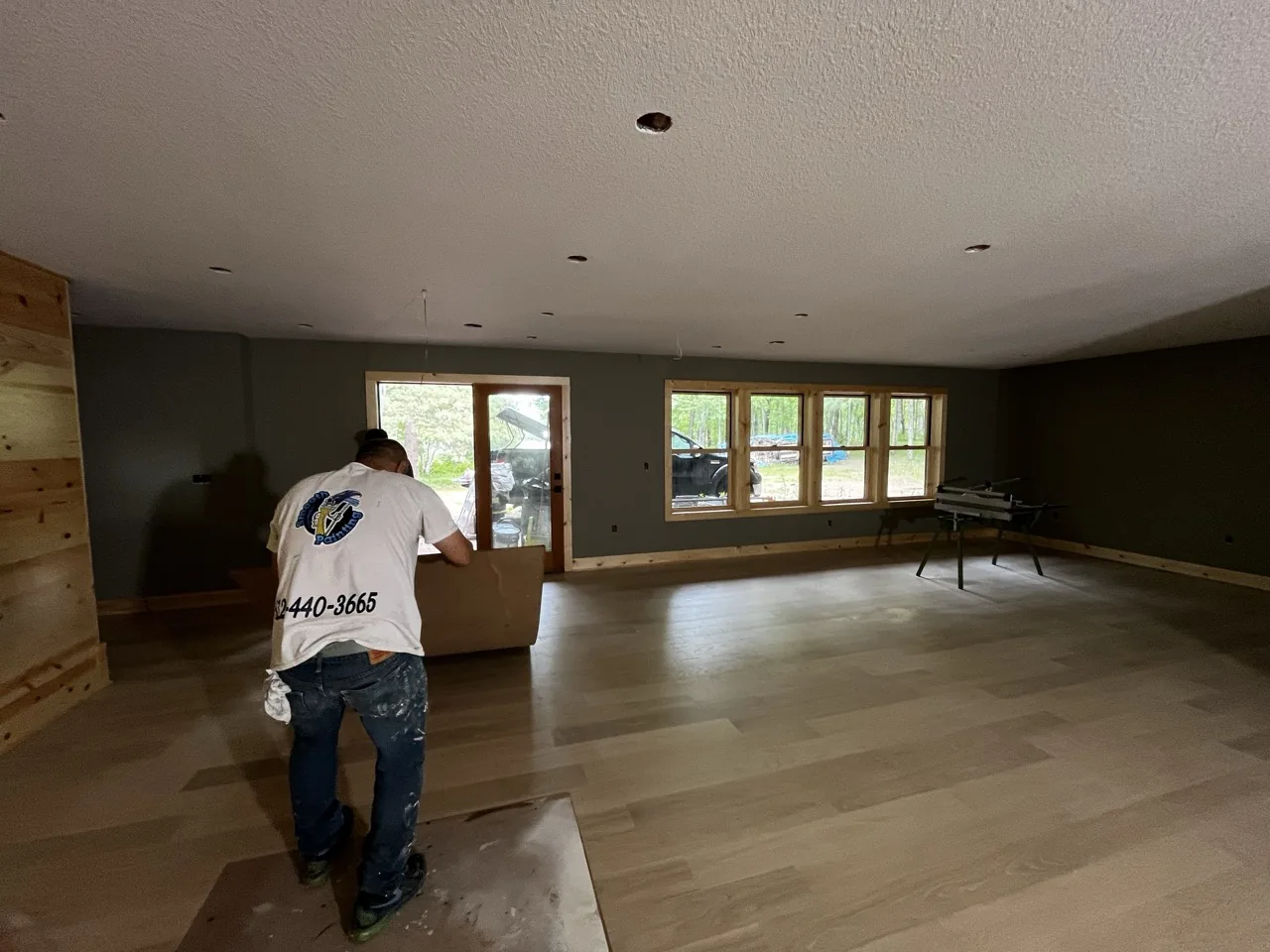 Smooth Painting crew masking and prepping a room before painting